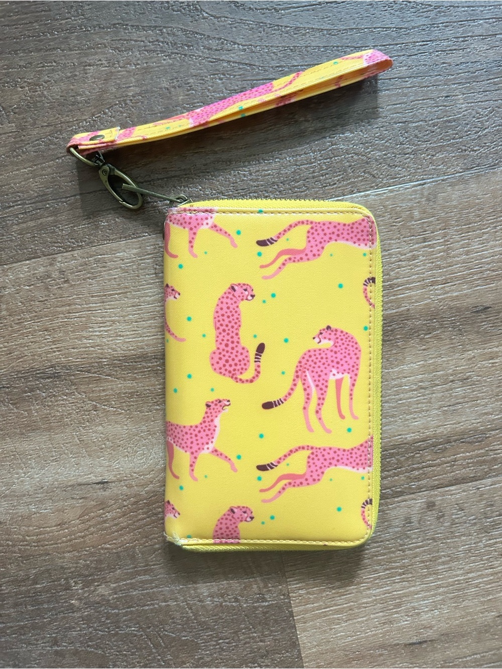 Wander Wallets Zip-around Wristlet with gold background and pink cheetahs